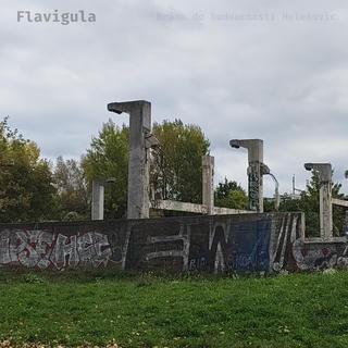 A skeletal concrete ruins peppered with graffiti